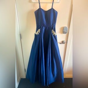 Blue/navy blue strapless gown. Brand: Blondie Nites by Stacy Sklar. Size 7.